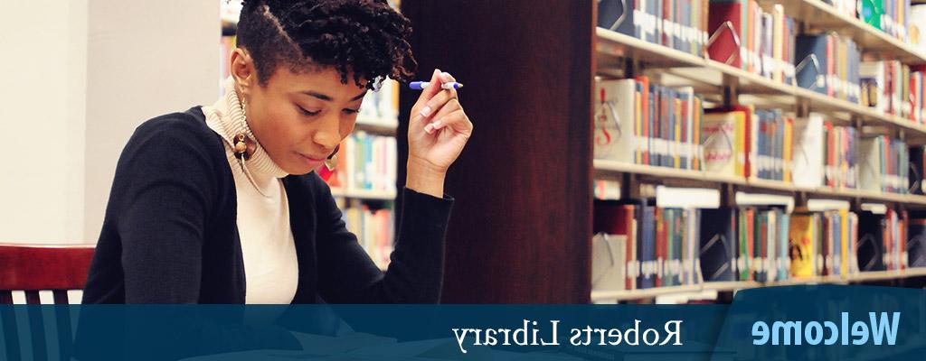 Welcome - Roberts Library - female student studying in library